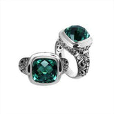 Handcrafted Bali silver ring with cushion-cut Green Quartz and artisan carvings.